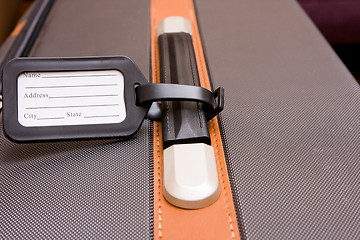 Image showing Black Luggage Tag On Baggage