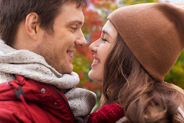 Image showing close up of happy teenage couple in autumn