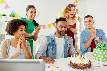 Image showing office team greeting colleague at birthday party