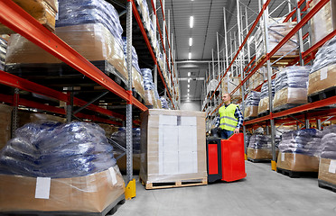 Image showing loader operating forklift at warehouse