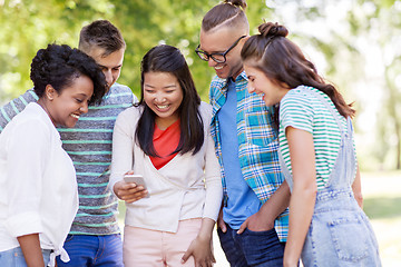 Image showing group of happy friends with smartphone outdoors