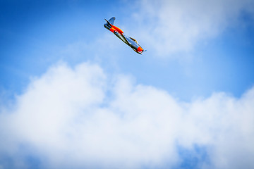 Image showing Plane diving on a blue sky