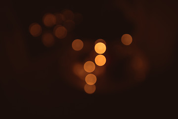 Image showing Golden bokeh on a dark brown background