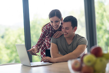 Image showing happy young couple buying online