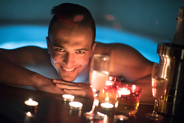 Image showing man relaxing in the jacuzzi