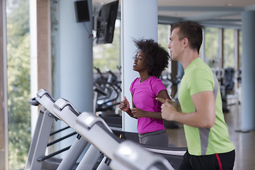 Image showing people exercisinng a cardio on treadmill