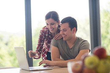 Image showing happy young couple buying online