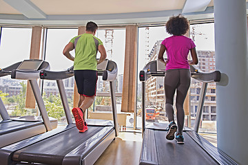 Image showing people exercisinng a cardio on treadmill in gym