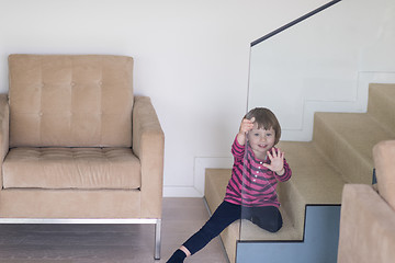 Image showing little cute girl enjoying on the stairs