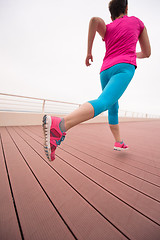 Image showing woman busy running on the promenade