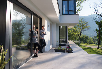 Image showing couple enjoying on the door of their luxury home villa