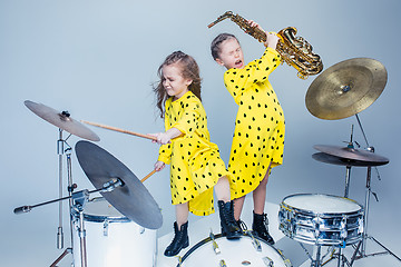 Image showing The teen music band performing in a recording studio