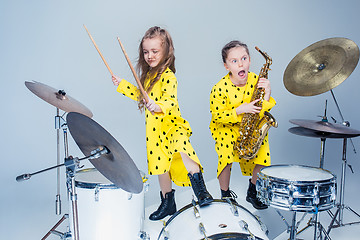 Image showing The teen music band performing in a recording studio