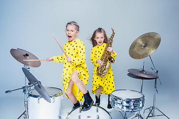 Image showing The teen music band performing in a recording studio