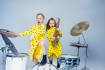 Image showing The teen music band performing in a recording studio