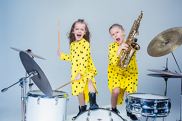 Image showing The teen music band performing in a recording studio