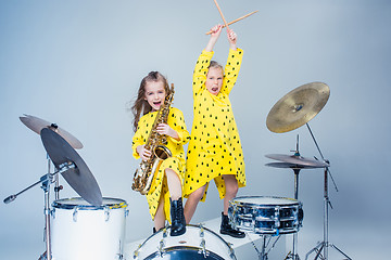 Image showing The teen music band performing in a recording studio