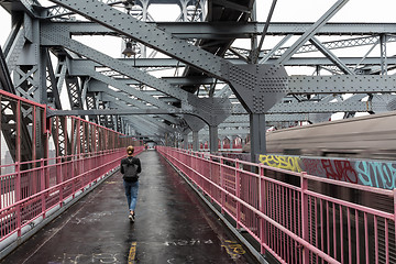 Image showing Solo casual woman walking the cycling lane on Williamsburg Bridge, Brooklyn, New York City, USA