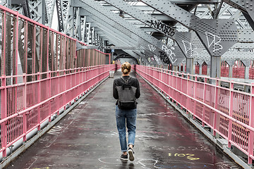 Image showing Solo casual woman walking the cycling lane on Williamsburg Bridge, Brooklyn, New York City, USA