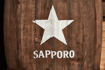 Image showing Sapporo beer logo on a barrel