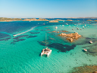 Image showing Drone aerial view of catamaran sailing boat in Maddalena Archipelago, Sardinia, Italy.