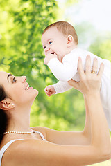 Image showing mother with baby over green natural background