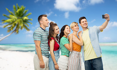 Image showing friends taking selfie by smartphone over beach
