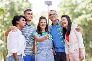 Image showing international friends taking selfie in park