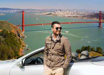 Image showing man at convertible car over golden gate bridge