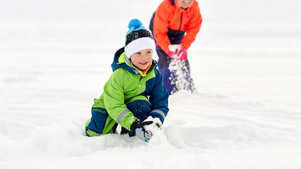 Image showing happy little kids playing outdoors in winter