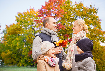 Image showing happy family over autumn park background