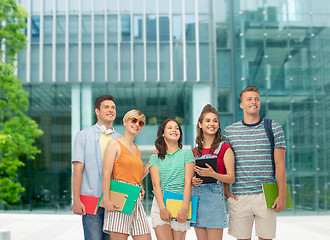 Image showing students with books and folders over modern school