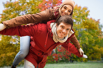 Image showing happy young couple having fun in autumn park