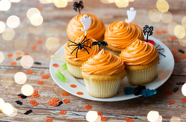 Image showing halloween party decorated cupcakes on plate