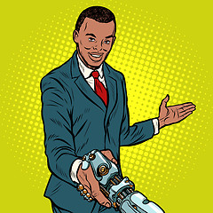 Image showing African businessman handshake to robot