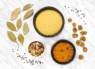 Image showing Couscous and cooking ingredients on marble background