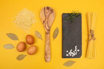 Image showing Cooking ingredients on bright yellow background