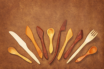 Image showing Handcrafted wooden utensils on leather background