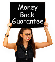 Image showing Money Back Guarantee Board Held By Girl