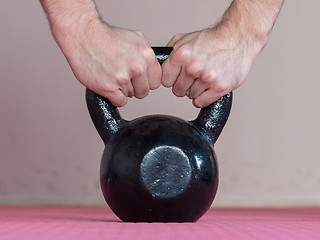 Image showing Black kettlebell ina gym