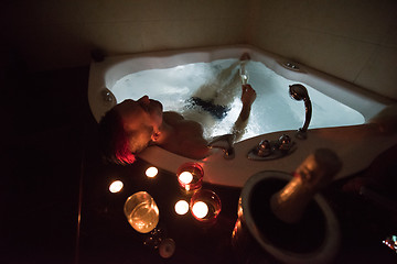 Image showing man relaxing in the jacuzzi