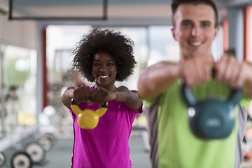 Image showing couple  workout with weights at  crossfit gym