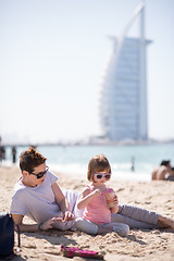 Image showing Mom and daughter on the beach