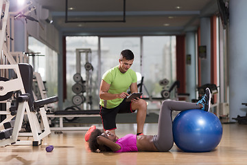 Image showing pilates  workout with personal trainer at gym