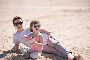 Image showing Mom and daughter on the beach