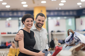 Image showing couple chooses shoes At Shoe Store