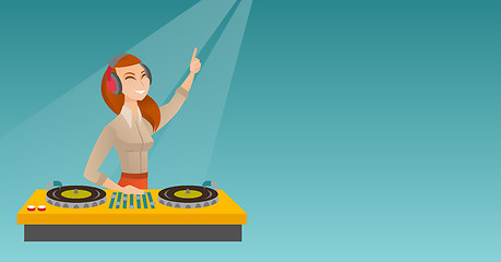 Image showing DJ mixing music on the turntables.