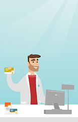 Image showing Pharmacist showing some medicine.