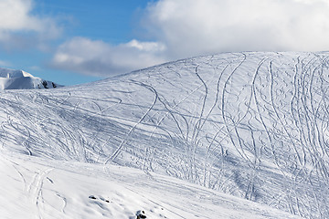 Image showing Slope for freeriding with traces from skis, snowboards and blue 