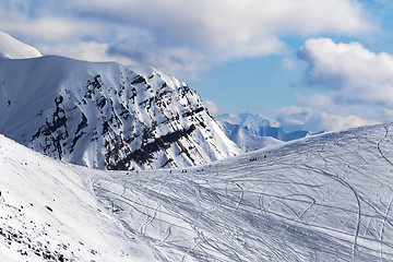 Image showing Snow off piste slope for freeriding with traces from skis, snowb